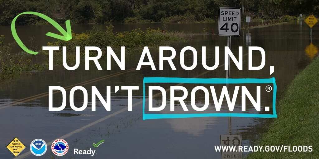 photo of flooded road with words turn around dont drown