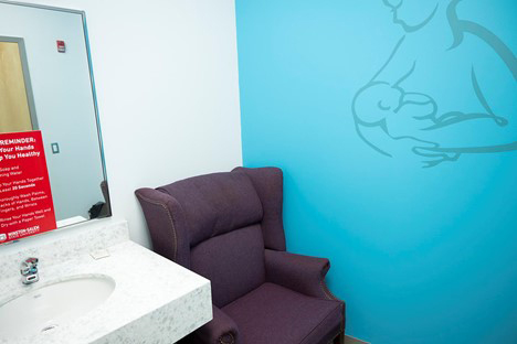 a lactation room, with a comfortable chair and sink