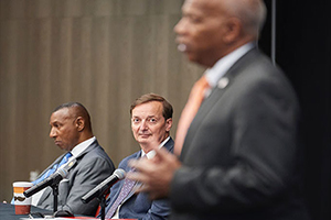 Photo by Bruce Chapman Sheriff Bobby Kimbrough and CSEM Director Craig Richardson listen as WSSU Chancellor Elwood Robinson, right, speaks at a recent panel on economic mobility.