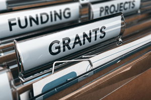 stock imagery of a file that has the word, "grants" on it.
