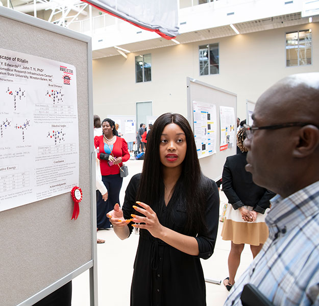 Student researcher with award