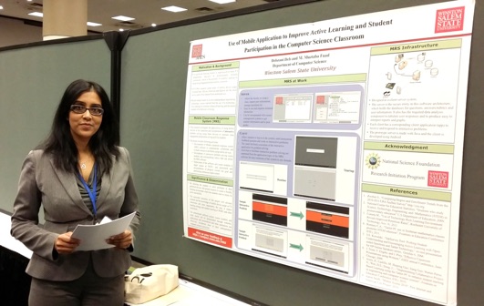 Dr. Deb in front of the poster at the ACM SIGCSE Conference.