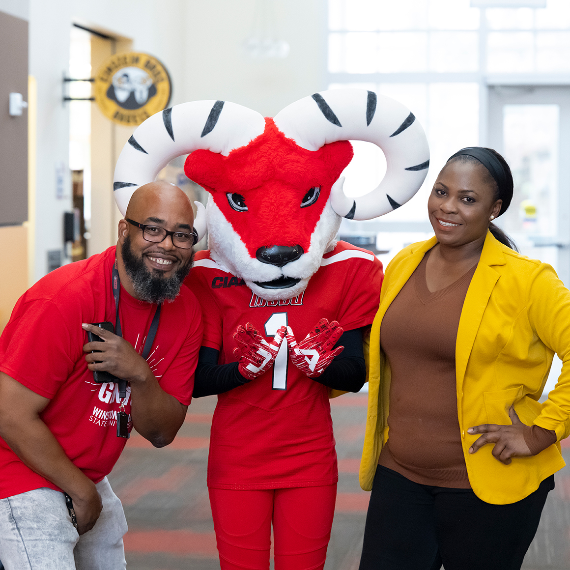 Faculty, advisor and employee with Ram mascot
