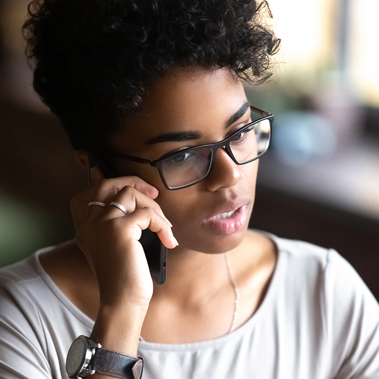 Image of a woman speaking on the phone