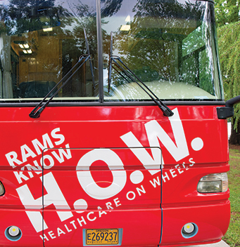 a bus with a Rams know H.O.W. logo on it.